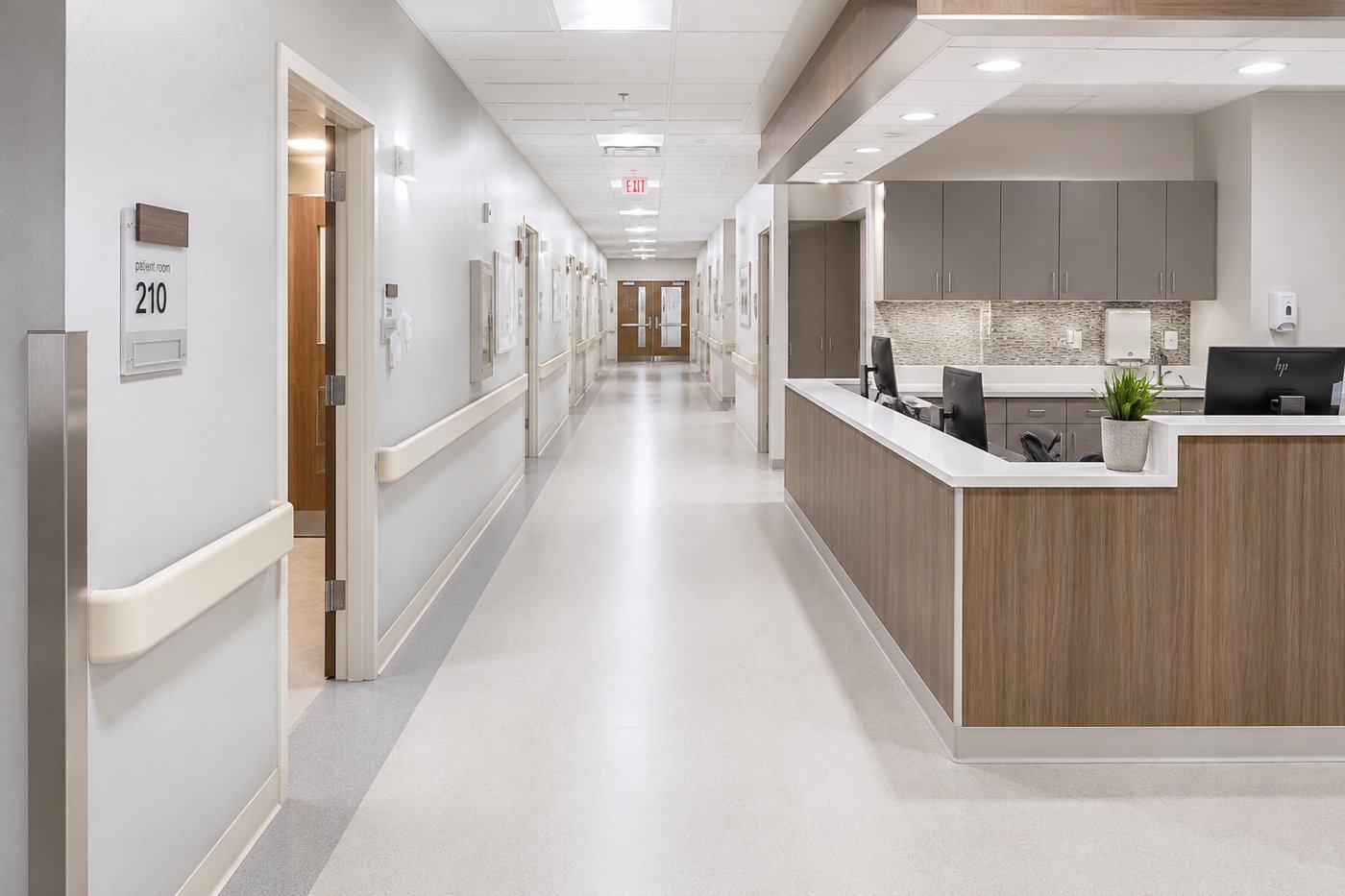 Healthcare facility corridor with wall protection, corner guards, and a nurse station — the kind of environment Vinguard supplies for